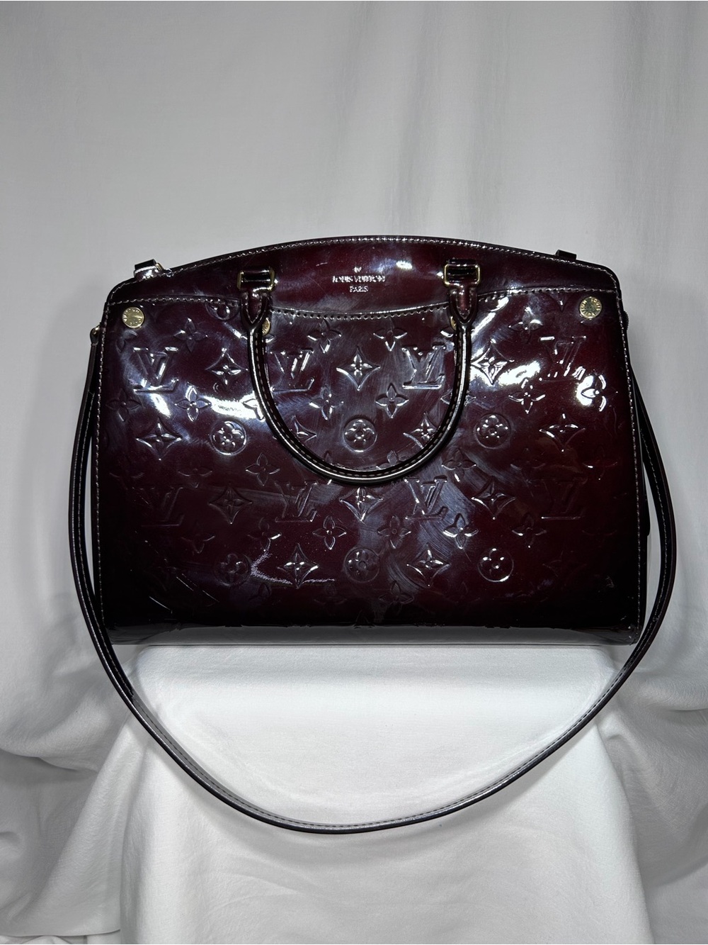 Louis Vuitton Brea top handle bag in Amarante Vernis leather gold hardware